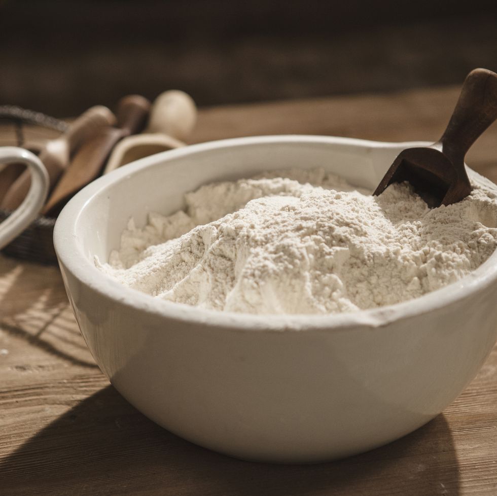 Close up of bowl of flour with scoop