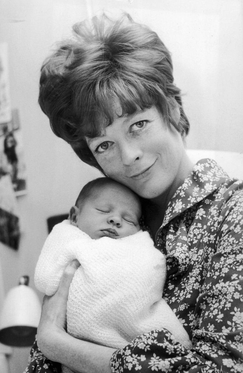 english actress maggie smith at the middlesex hospital with toby, her baby son with actor husband robert stephens