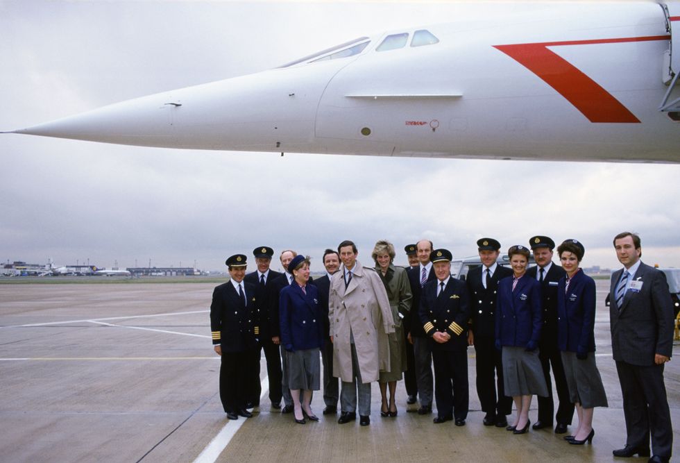 Prince Charles and Princess Diana pose with the Concorde crew at Heathrow Airport after their April 1986 trip to Vienna, Austria