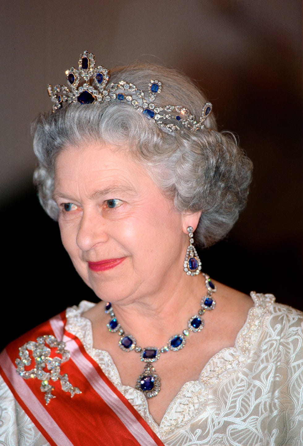 prague, czech republic march 27: queen elizabeth ii attending a banquet in prague wearing a sapphire and diamond tiara which she had made to match the cluster necklace and earrings which were a wedding present from her father, george vi. (photo by tim graham photo library via getty images)