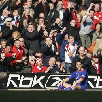 liverpool supporters shout at manchester united captain gary neville during their english fa cup match at anfield, liverpool, 2006