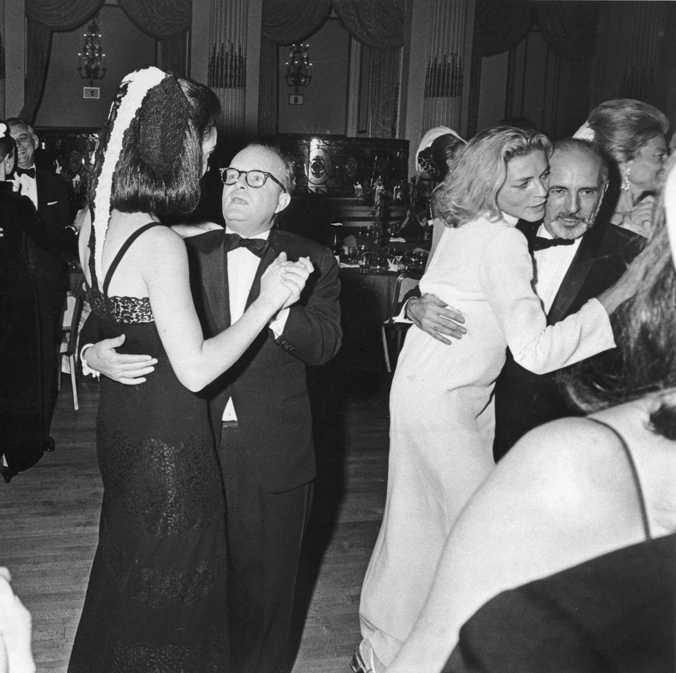american novelist, short story writer, and playwright truman capote 1924   1984 center dances with an unidentified woman at his black and white ball held in the grand ballroom of the plaza hotel, new york, new york, november 28, 1966 to the left, american publisher katherine graham 1917   2001, publisher of the washington post and capotes guest of honor dances with an unidentified man to the right, american actress lauren bacall dances with american dancer and choreographer jerome robbins 1918   1988 photo by express newspapersgetty images