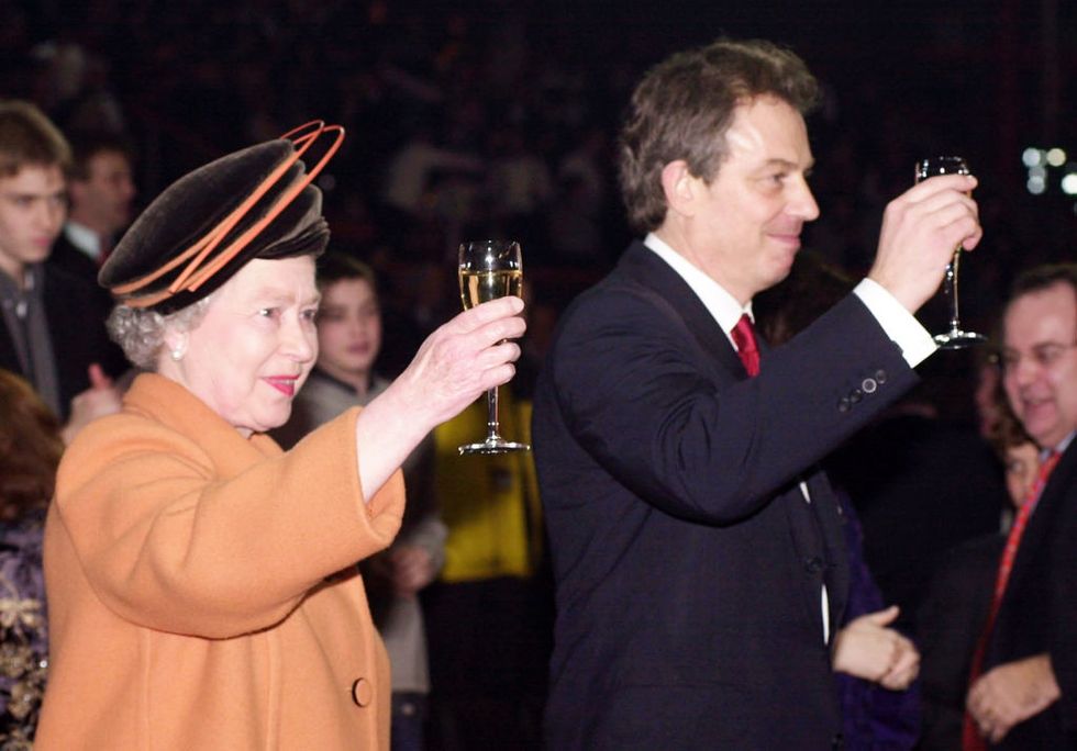 london december 31 queen elizabeth ii and british prime minister tony blair raise their glasses as midnight strikes during the opening celebrations on december 31, 1999 at the millennium dome in greenwich in london photo by anwar husseingetty images