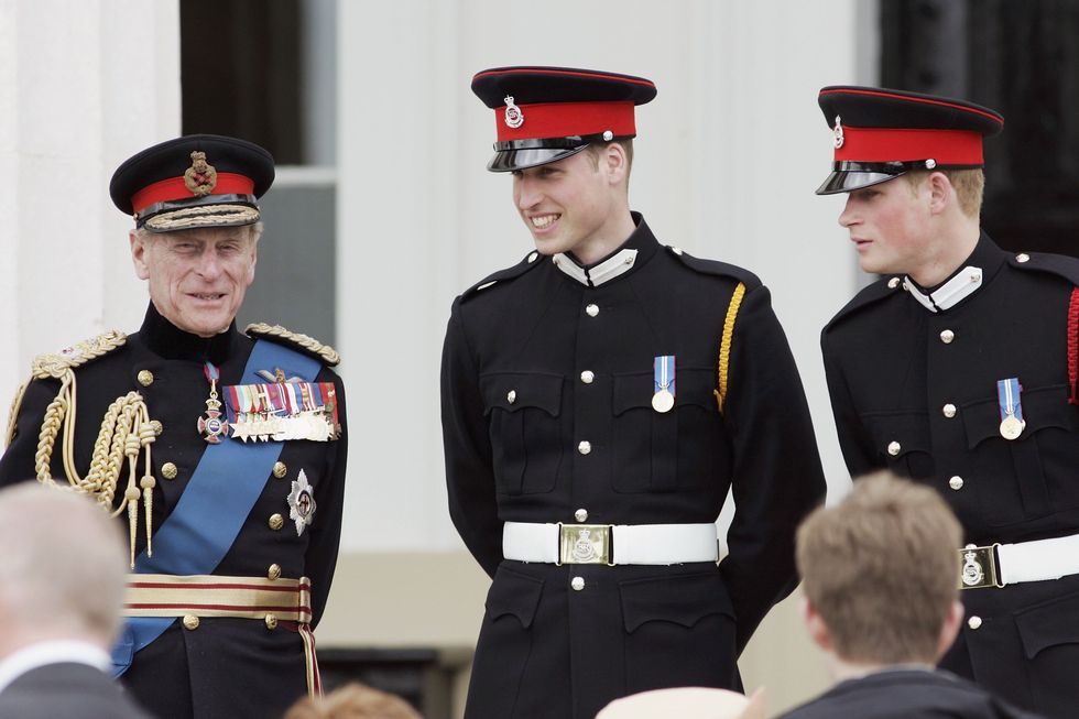 surrey, england   april 12 prince william and prince harry r chat to their grandfather, prince philip, duke of edinburgh on the steps of the old college after the sovereigns parade at sandhurst military academy on april 12, 2006 in surrey, england photo by tim graham photo library via getty images