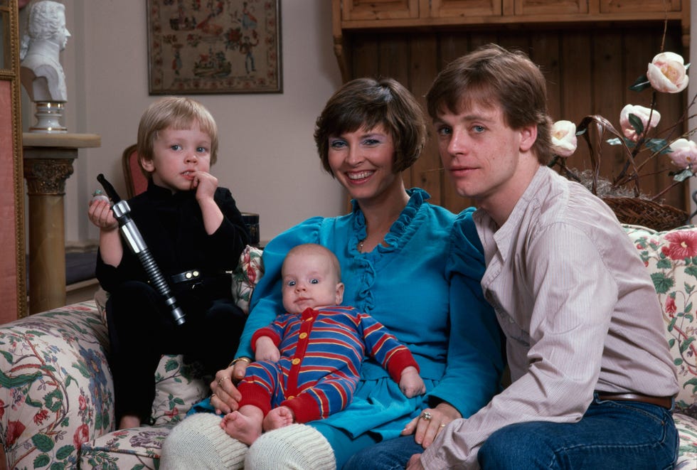 ​Mark and Marilou, along with their sons, Nathan and Griffin, at their home in Los Angeles.