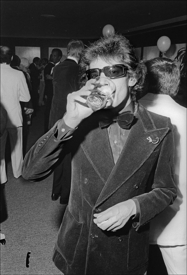 american photographer and artist robert mapplethorpe drinks from a glass at the man ray bal blanc at the new york cultural center, new york, new york, january 15, 1975 photo by allan tannenbaumgetty images
