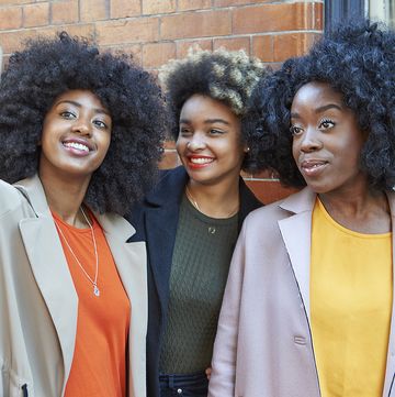 Hair, People, Afro, Social group, Hairstyle, Yellow, Jheri curl, Fun, Smile, Youth, 