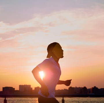 Man enjoying an early morning jog in the city. ezra bailey