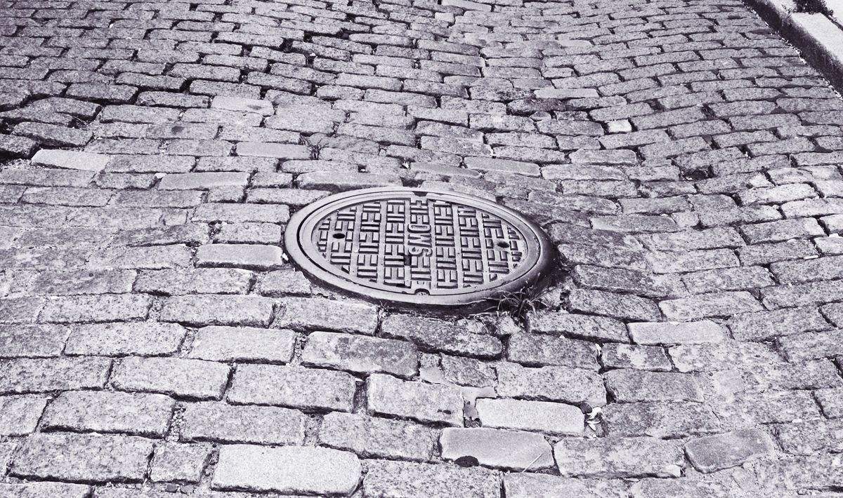 Cobblestone, Manhole cover, Manhole, Brick, Brickwork, Road surface, Black-and-white, Public utility, 