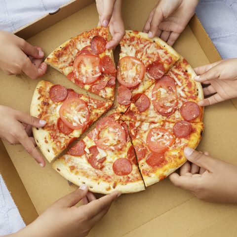 people eating delivery pizza out of the box