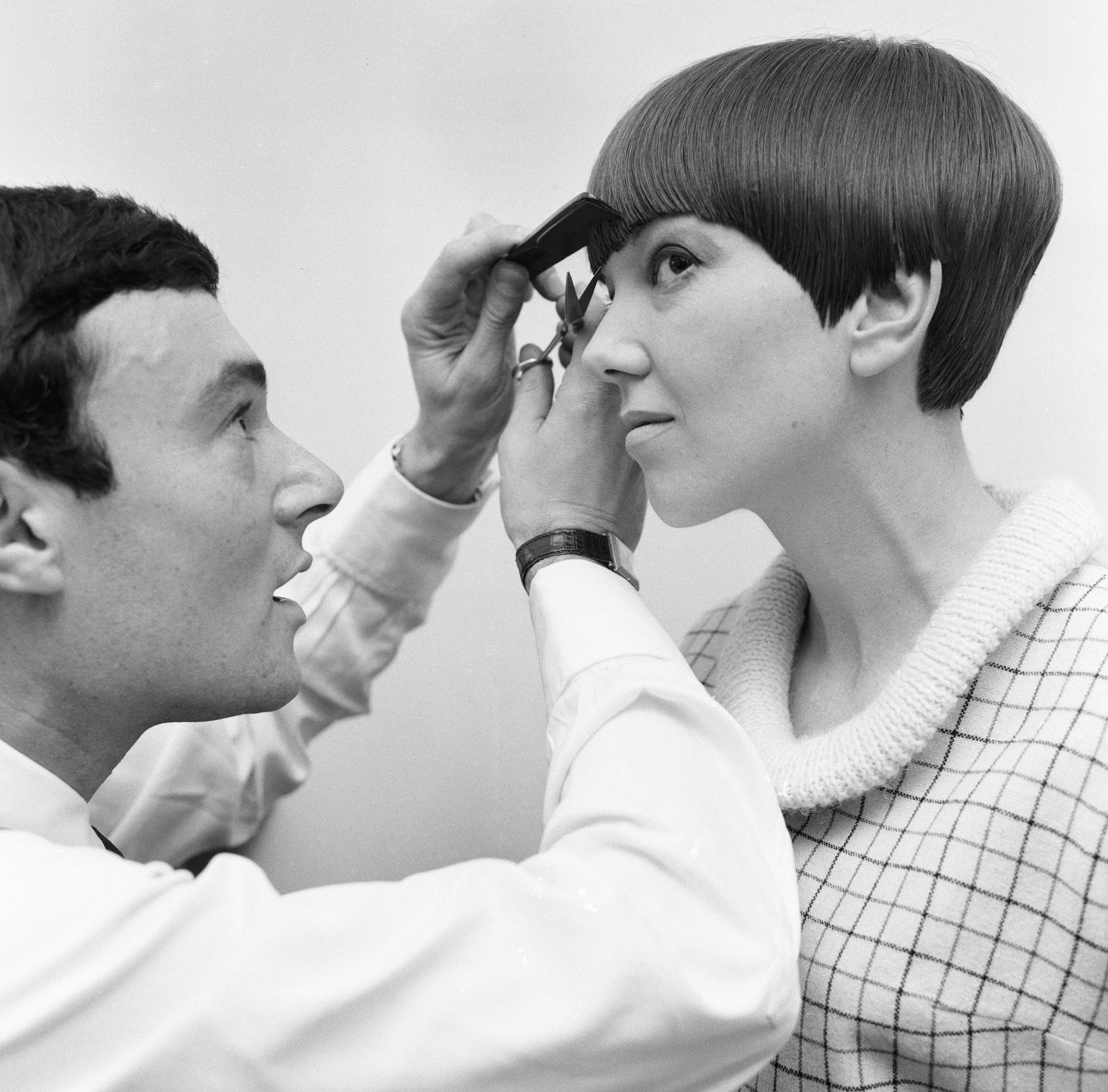 Fashion designer Mary Quant seen here having the finishing touches made to her new hairstyle by Vidal Sassoon 12th Novem