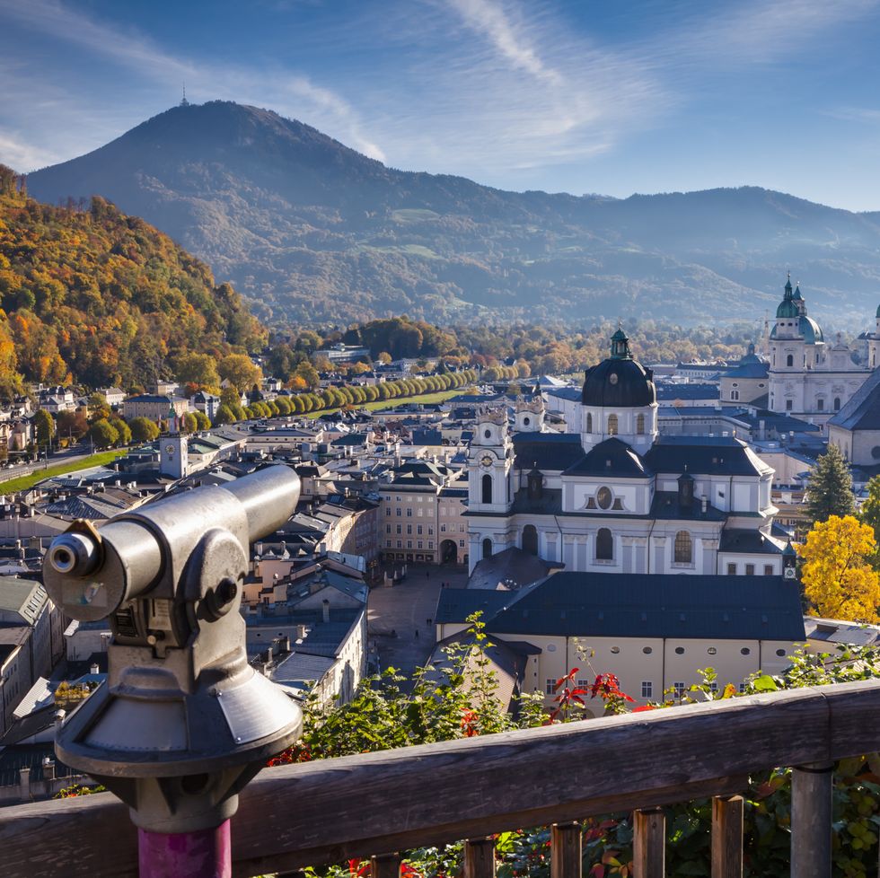 telescope overlooking the old town of salzburg from mönchsberg mountain salzburg, austria