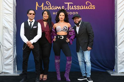 hollywood, ca   august 30 selenas husband chris perez l, sister suzette quintanilla 2nd l, and brother ab quintanilla r onstage during madame tussauds hollywoods unveiling of singer selena immortalized in wax at madame tussauds  on august 30, 2016 in hollywood, california  photo by rachel murraygetty images for madame tussauds hollywood