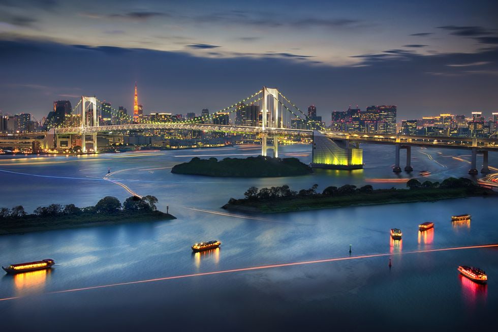 view of the downtown buildings and bridges of tokyo bay at dusk