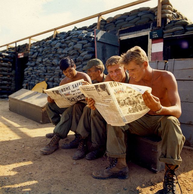 members of battery a, 7th battalion, 8th artillery, read the news of the apollo 13 splashdown in the stars and stripes newspaper, bien hoa, viet nam, april, 1970 left to right are spc 4 patrick rogan, spec 4 neal goldworth, cpl jerry isokane and spec 4 bruce barling photo by photoquestgetty images