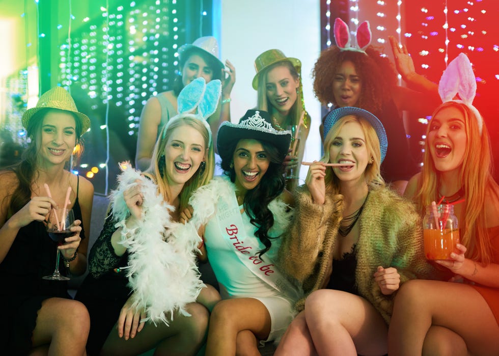 portrait of a group of young woman having a bachelorette party at a nightclub