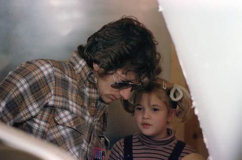 steven spielberg speaks to a young drew barrymore on the set of et
