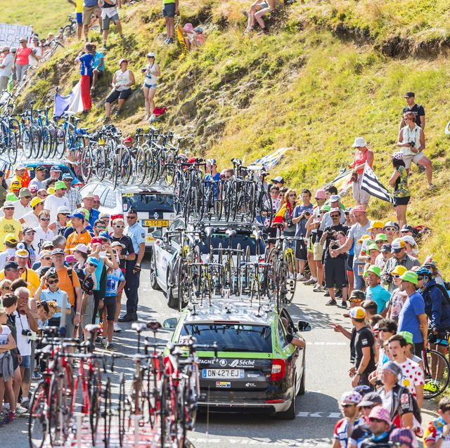 col du glandon, france july 23, 2015 row of technical cars driving on the road to col du glandon in alps during the stage 18 of le tour de france 2015