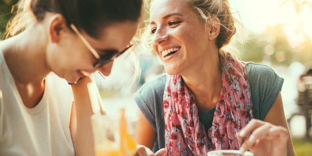 Female friends talking in cafe