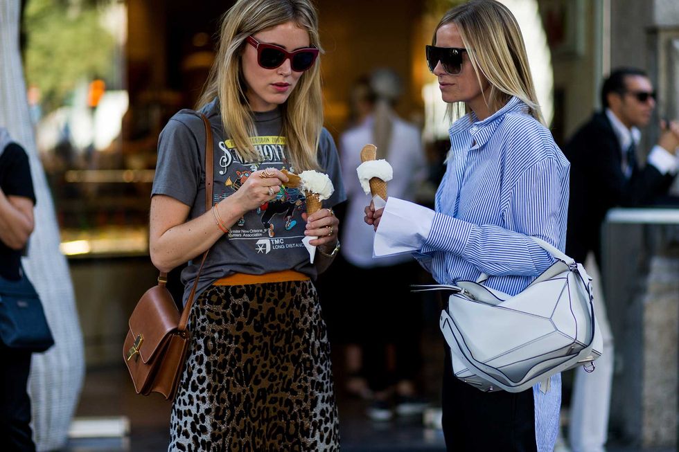 a couple of women holding ice cream cones