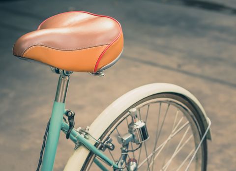 Bicycle part, Bicycle, Bicycle wheel, Bicycle saddle, Orange, Vehicle, Bicycle accessory, Pink, Mode of transport, Bicycle tire, 