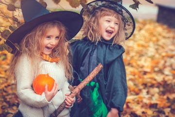 little girls dressed up as witches for halloween