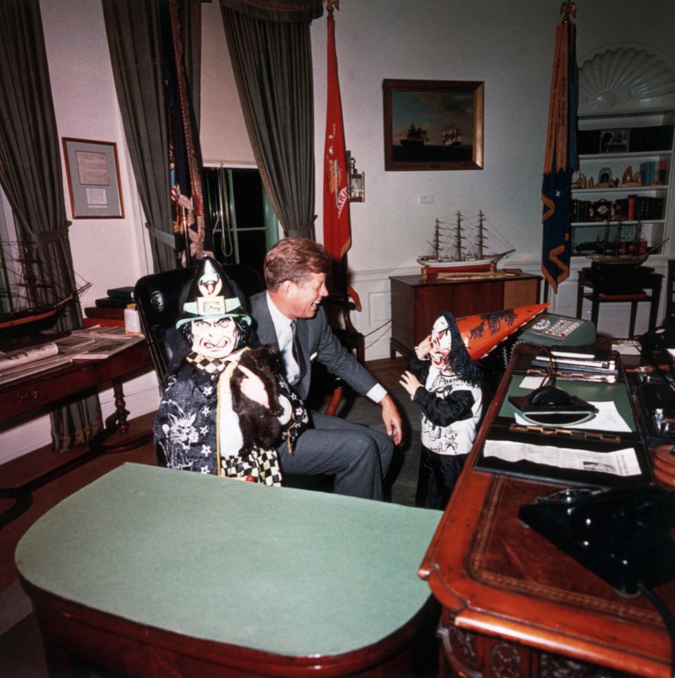 president kennedy laughs at the halloween costumes modeled by his children caroline, and john, jr, october 31, 1963 photo by © corbiscorbis via getty images