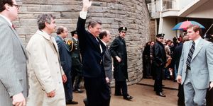 President Ronald Reagan waves as he leaves the Washington, D.C. Hilton just before being shot by John Hinckley Jr. in an assassination attempt on March 30, 1981