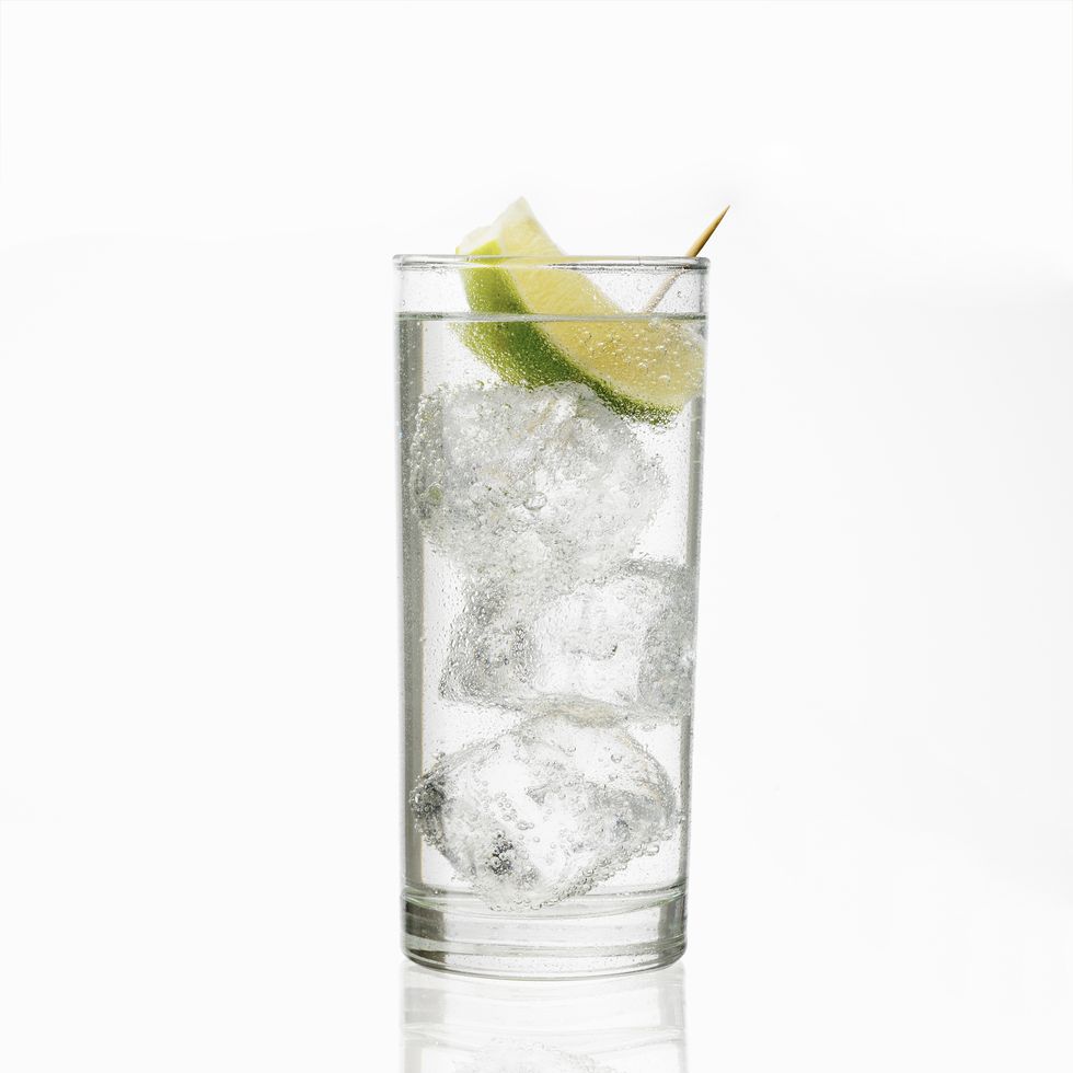 Gin tonic or soda isolated on white background