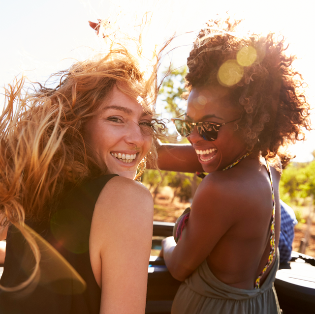 best sunscreens for face two friends in smiling in sunlight