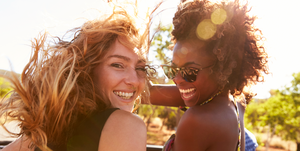 best sunscreens for face two friends in smiling in sunlight