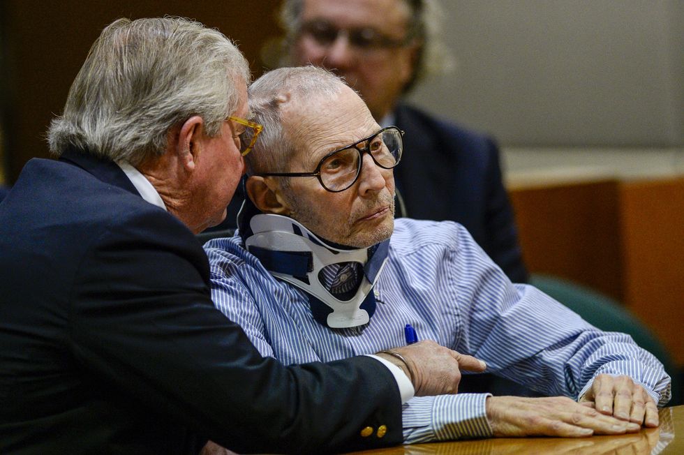 ​Robert Durst talks to his defense attorney, Dick DeGuerin, on November 6, 2016 during his arraignment in the Susan Berman case. 
