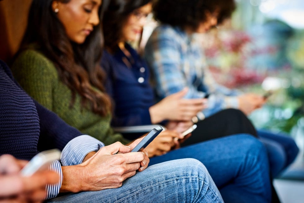 Mobile phones in hands of business people