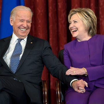 US-CONGRESS-REID-PORTRAIT us vice president joe r biden l and former secretary of state hillary clinton laugh during a portrait unveiling for outgoing senate minority leader senator harry reid d nv on capitol hill december 8, 2016 in washington, dc afp brendan smialowski photo credit should read brendan smialowskiafp via getty images
