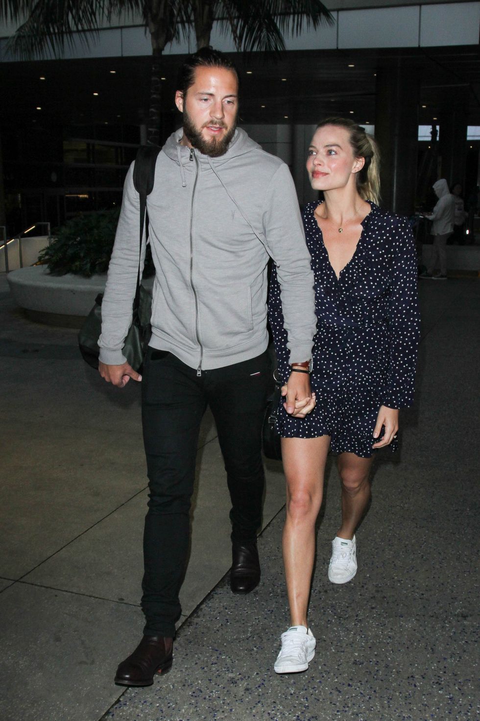 los angeles, ca january 02 margot robbie and tom ackerley are seen at lax on january 02, 2017 in los angeles, california photo by starzflybauer griffingc images