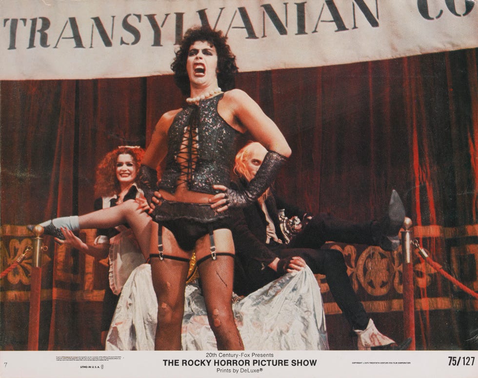 The Rocky Horror Picture Show from right to left, actors richard obrien, tim curry and patricia quinn as riff raff, dr frank n furter and magenta respectively, on a lobby card from the 1975 musical comedy the rocky horror picture show, produced by 20th century fox. (photo by movie poster image art/getty images)