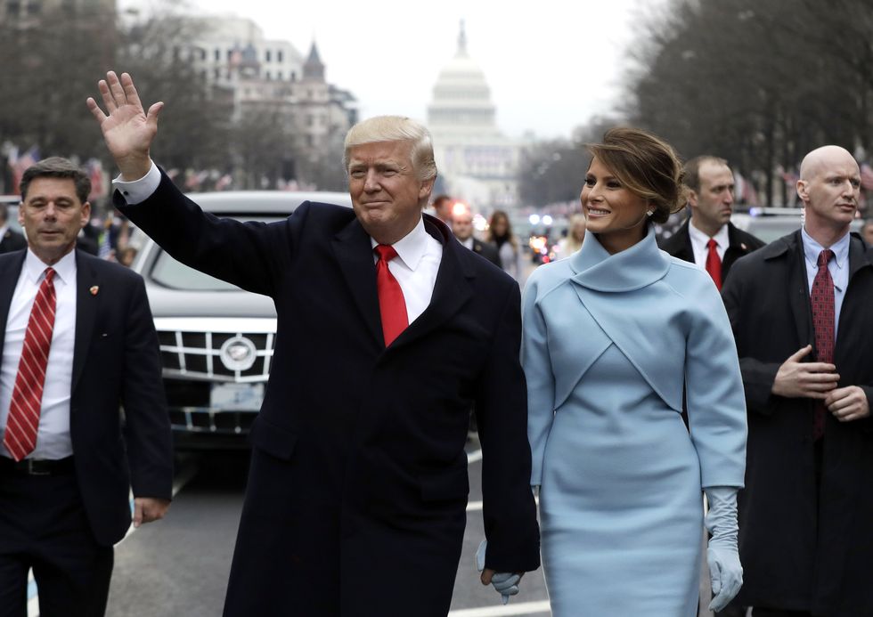 washington, dc   january 20  us president donald trump waves to supporters as he walks the parade route with first lady melania trump after being sworn in at the 58th presidential inauguration january 20, 2017 in washington, dc donald j trump was sworn in today as the 45th president of the united states  photo by evan vucci   poolgetty images