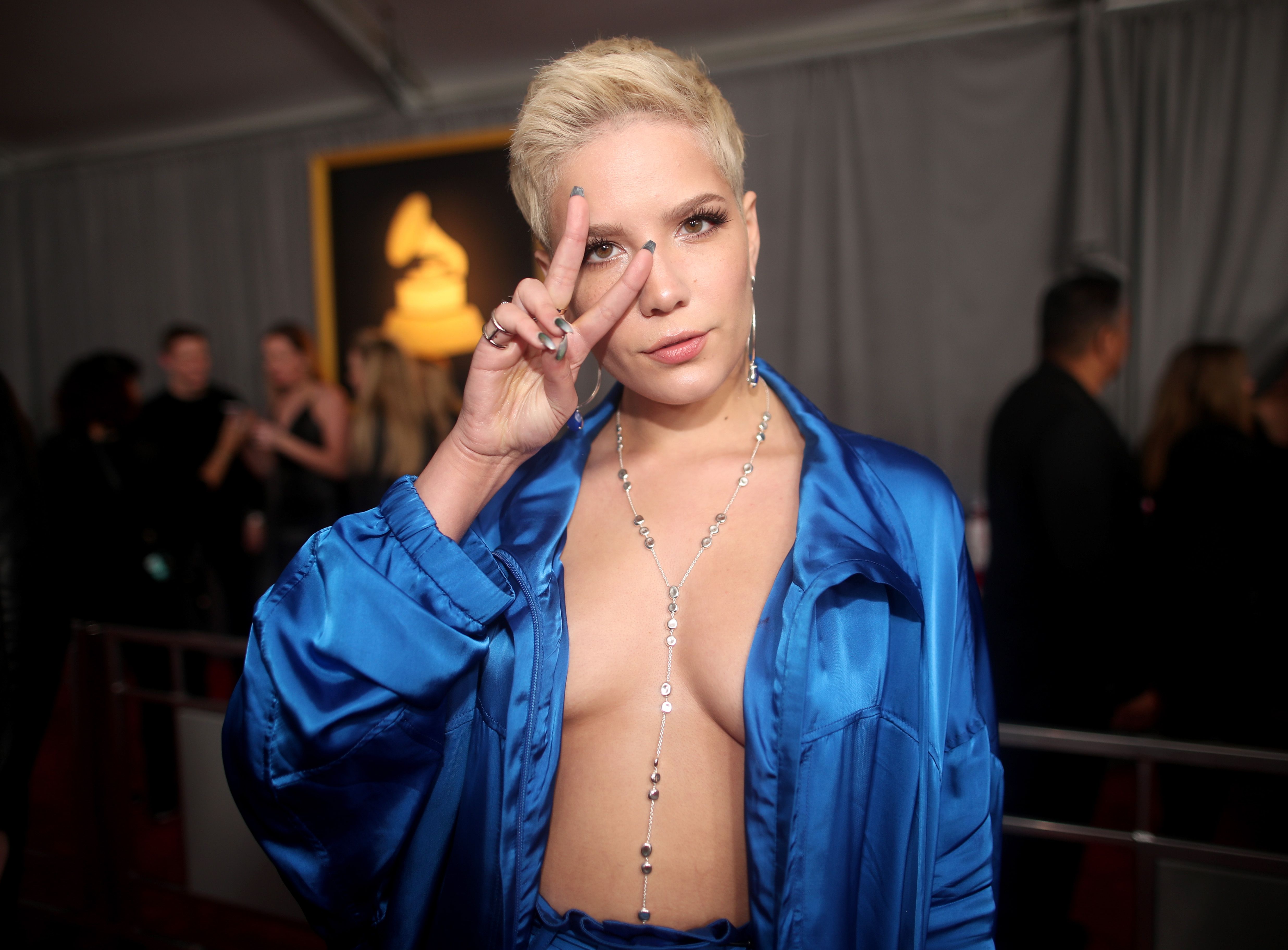 Sorry my boobs came out': Halsey suffers wardrobe malfunction