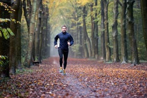 man running in forest