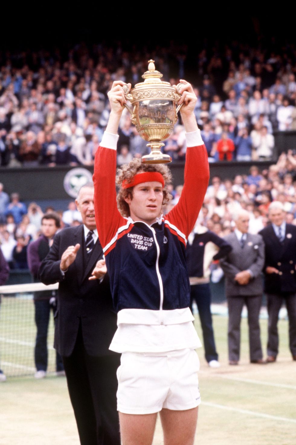 john mcenroe holds aloft the trophy following his victory  photo by sgpa images via getty images