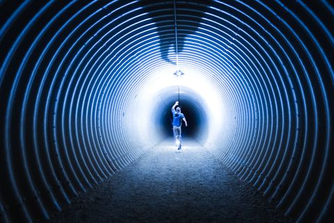 Man running in tunnel 
