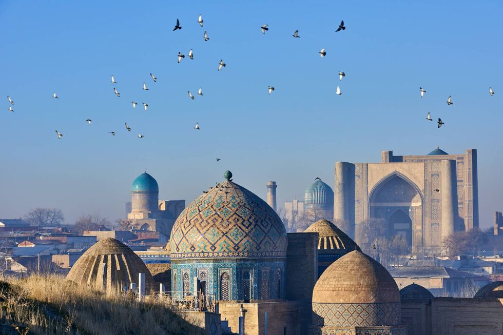 Dome, Blue, Mosque, Landmark, Sky, Architecture, Building, Place of worship, City, Bird, 
