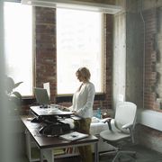 woman using standing desk