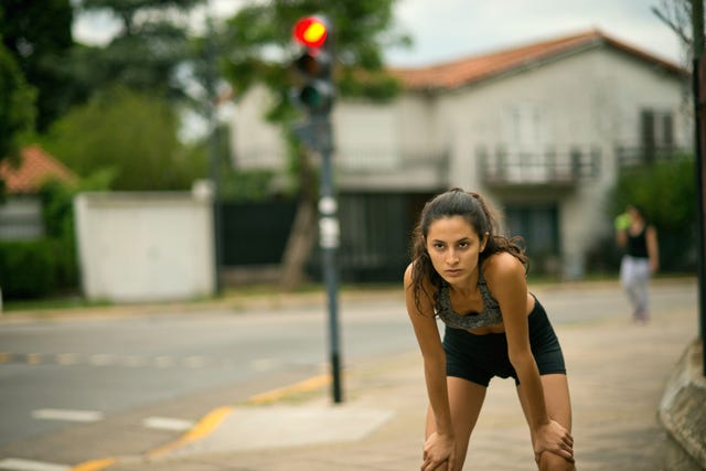 tired woman resting after running