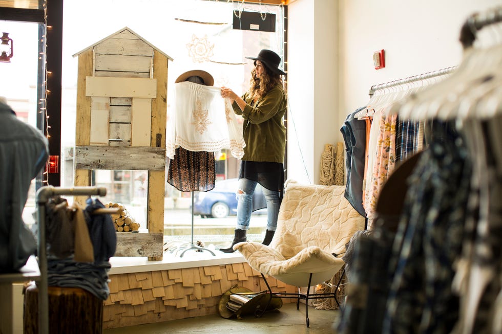 A woman in her clothing store.