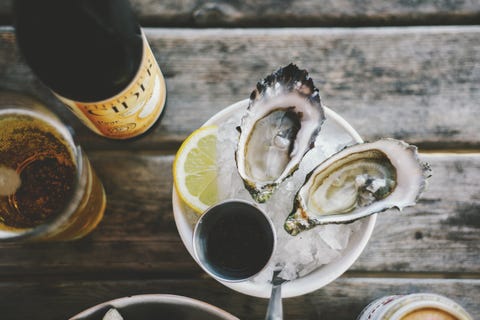 directly above shot of oysters served in cup with ice