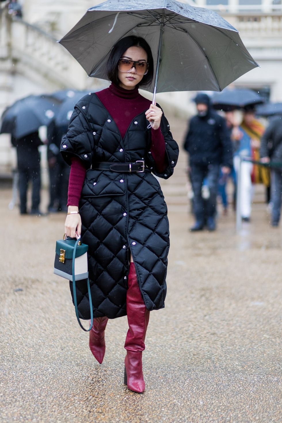 paris, france   march 06 yoyo cao wearing a black puffy coat, turtleneck, overknees outside stella mccartney on march 6, 2017 in paris, france photo by christian vieriggetty images