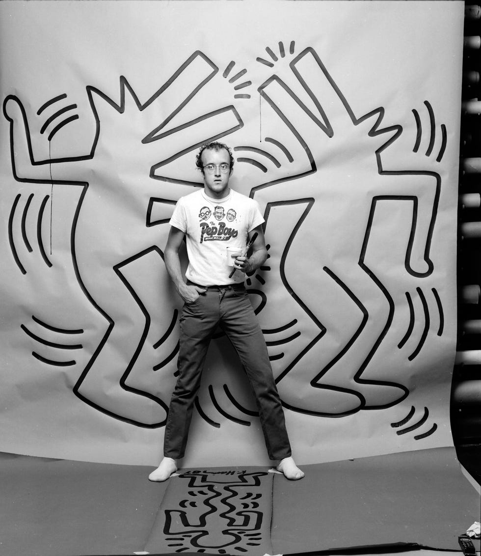 graffiti and visual artist keith haring photographed with one of his paintings in april 1984. photo by jack mitchell/getty images.