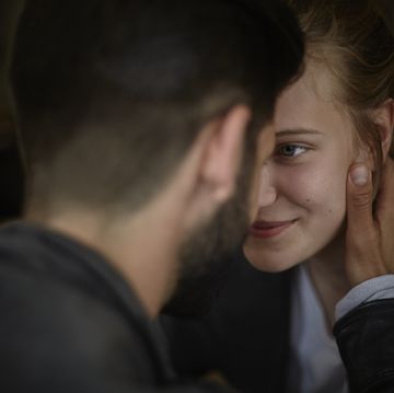 Smiling young woman looking at boyfriend