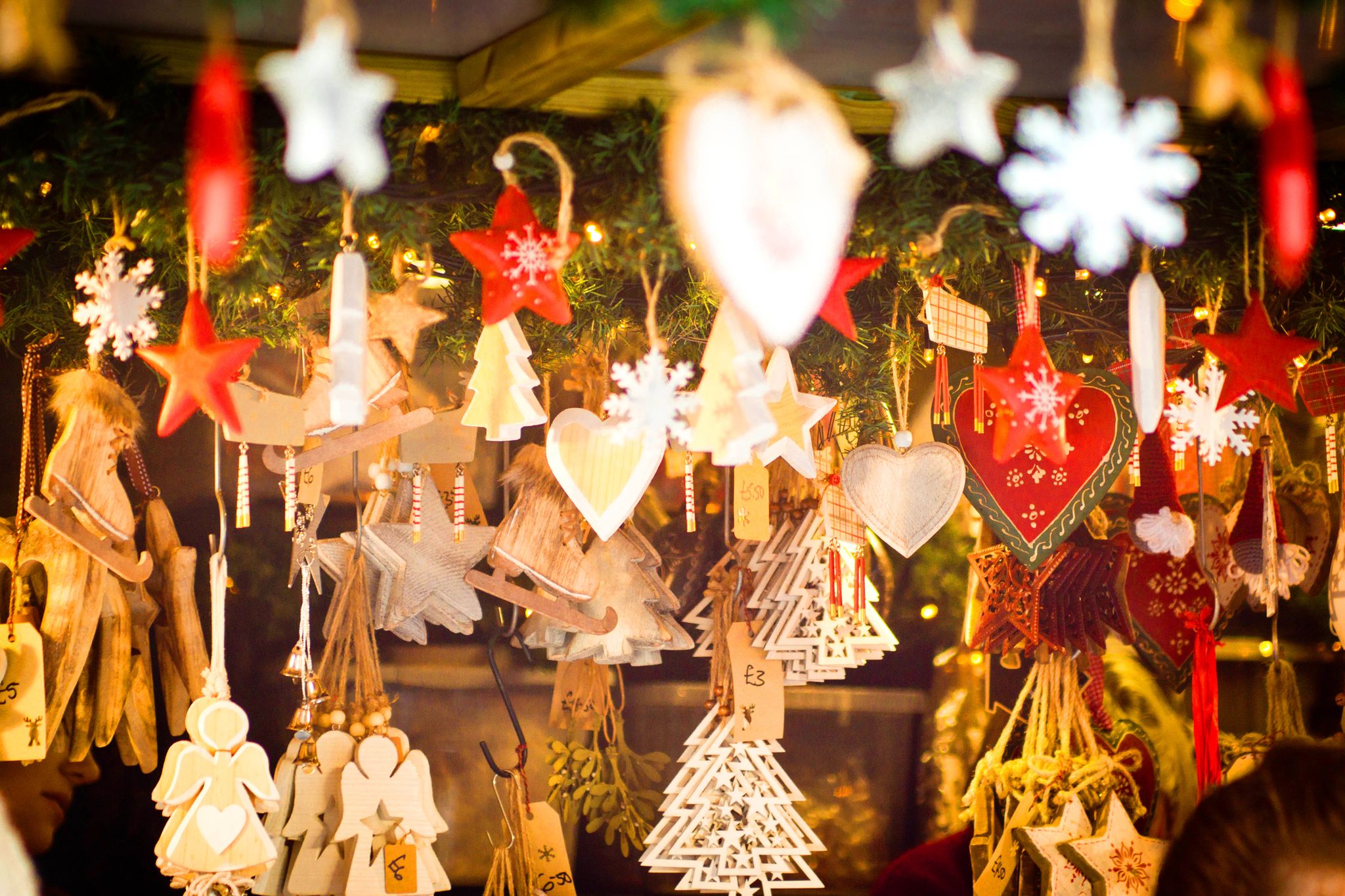 shaped hanging ornaments to act as christmas decorations on sale at lincoln christmas market they are in the shape of stars, christmas trees, angels and hearts